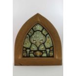 An early painted & leaded glass panel of arch form,