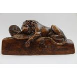A 19th century carved wood sculpture after The Lion of Lucerne,