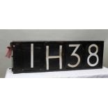 An original and working locomotive head board with revolving numerals and letters. 38cm x 118cm excl