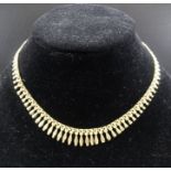 A 9ct gold necklace, graduated decorative link design