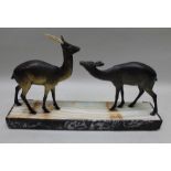 A French Art Deco period figural group of two stylised deer