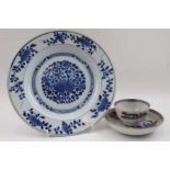 A Chinese 18th century blue and white floral pate 22cm diameter together with a red and blue tea bow