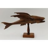 A Pitcairn Islands carved hardwood flying fish