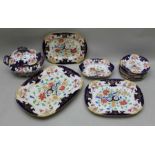 A selection of 19 century polychrome decorated dinner wares with large lidded touring graduating gra