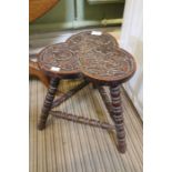 A carved oak stool