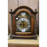 A reproduction German mantel clock, with chiming movement, complete with key