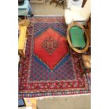 A room sized woven woollen geometric patterned floor carpet, 310cm x 204cm