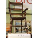 An Oxford style slat back armchair or typical form & construction with a three-piece ladder back