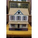 A modern dolls house with a good selection of interior furnishings