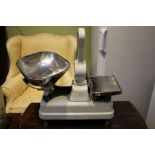 A white enamelled set of Avery professional shop scales with stainless steel pans