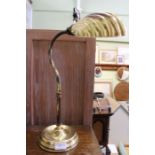 A brass table lamp, with scallop shade