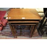 A mahogany nest of three tables