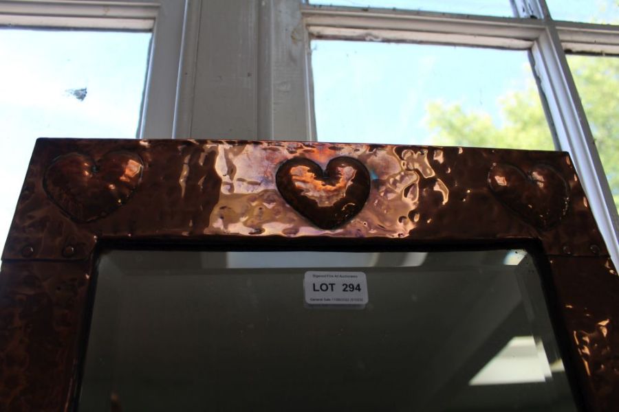 An Arts & Crafts copper framed rectangular bevel plate wall mirror, with a trio of heart motifs - Image 2 of 2