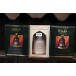 Three boxed Bells Commemorative Whisky Decanters, sealed with contents.