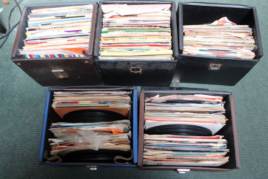 Five vinyl cases containing an extensive selection of 7" singles