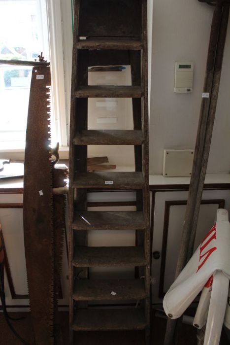 A vintage set of wooden ladders