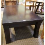 A modern stylised dark wooden coffee table
