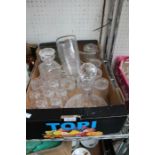 A box of glass items, the majority for the storage and serving of beverages