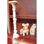 A decorative carved and painted wooden "Jolly Pig", together with a serious looking cat, an a cast r