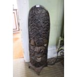 An African floor standing carved wooden figure head