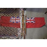 Two red Ensigns from motor launch sterns
