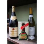 Two bottles of white wine and a boxed Moet & Chandon Petite Liquorelle