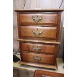 A mahogany four drawer table chest