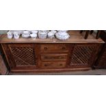 An imported sideboard with three central drawers