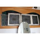 Four wooden framed leaded glass window panels