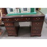 A reproduction mahogany twin pedestal desk