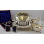 A quantity of silver plate, includes a pair of gravy boats, knife rests,