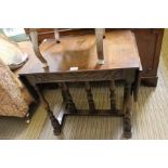 A good quality re-production oak occasional table