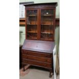 A early 20th century mahogany bureau book case