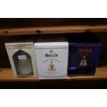 Three commemorative bells whisky decanters plus co