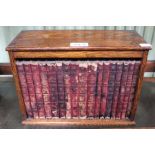 A desk top oak cabinet of leather bound novels by Thackery