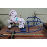 A metal rocking horse, together with two Pogo stic
