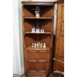 An Ercol full standing corner unit