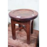 A small oak stool with dished circular top