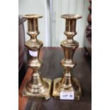 A pair of brass candle sticks