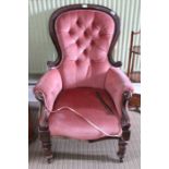 A Victorian show wood frame button back arm chair