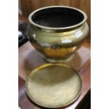 An oriental brass planter with small hammered plat