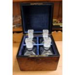 A 19th Century walnut four bottle decanter box hav