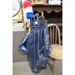 A blue MacGregor golf bag plus contents