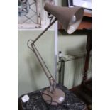 A buff coloured three spring anglepoise lamp