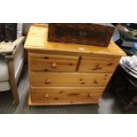 A small modern pine chest of drawers