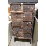 A rustic wooden ten drawer chest