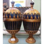 A pair of blue and gilt finished cup and covers with crown finial