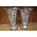 A pair of cut glass vases