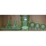 A selection of moulded green domestic glassware