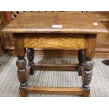 A reproduction carved leg joint stool